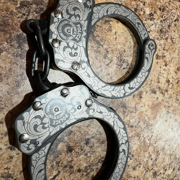 7002- Custom Engraved Peerless handcuffs